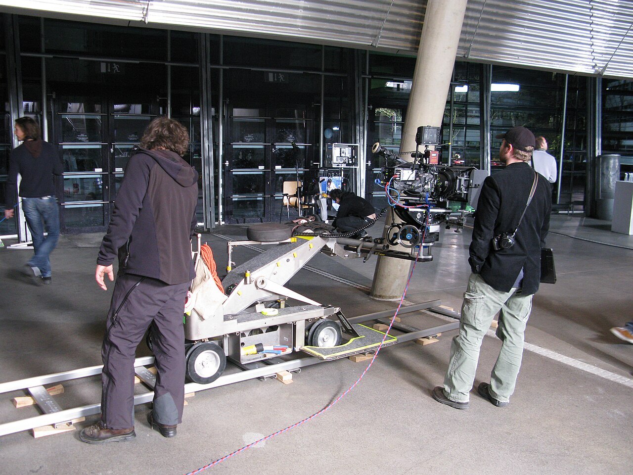 Film camera mounted on a dolly during a shoot.