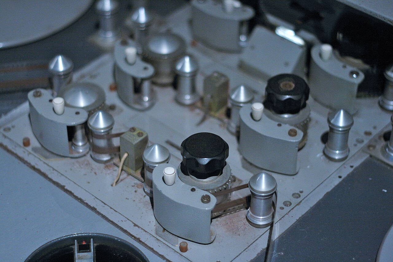 Mechanical film-editing equipment with rollers and film guides.
