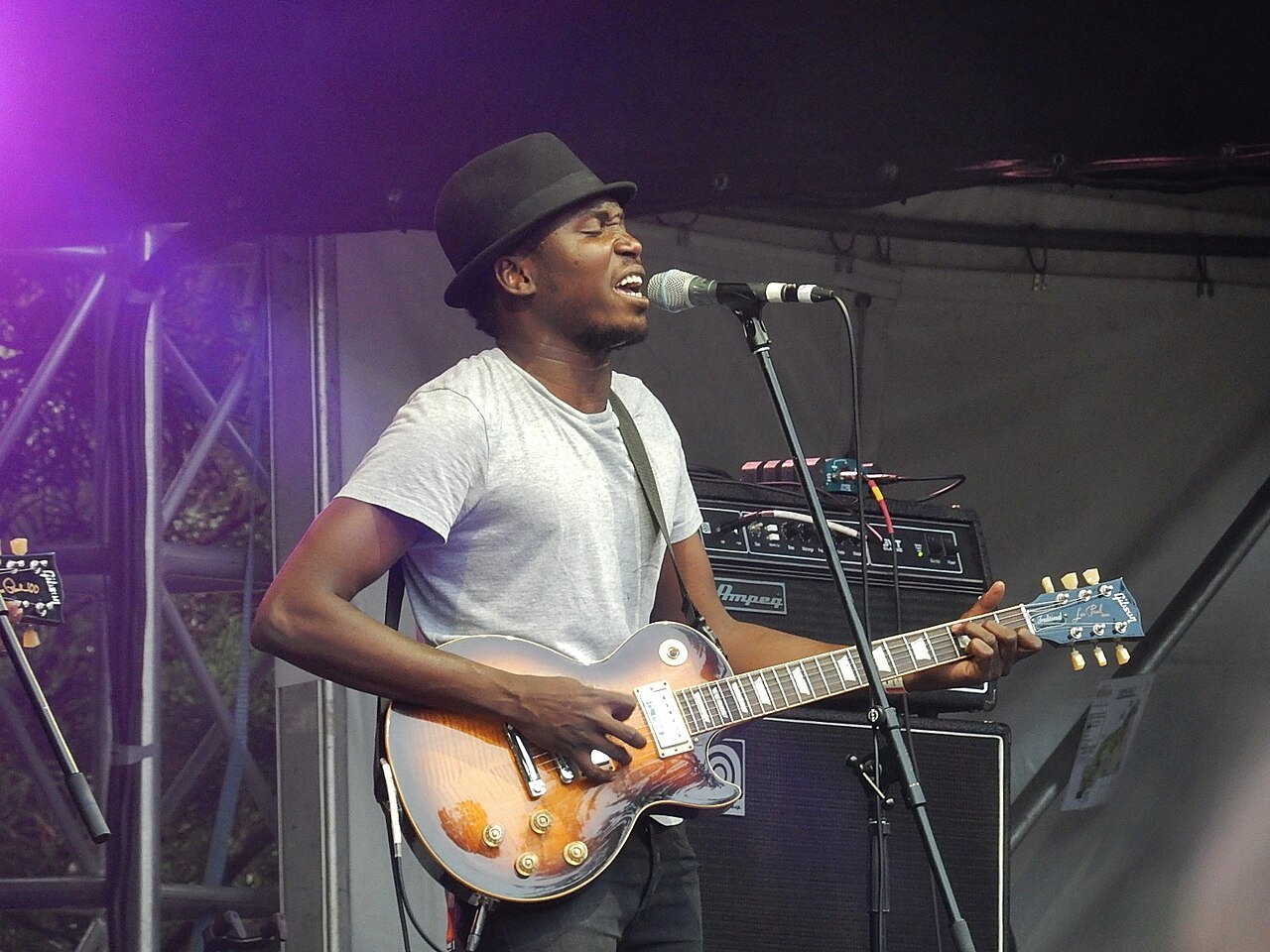 Guitarist from Songhoy Blues performing on stage.