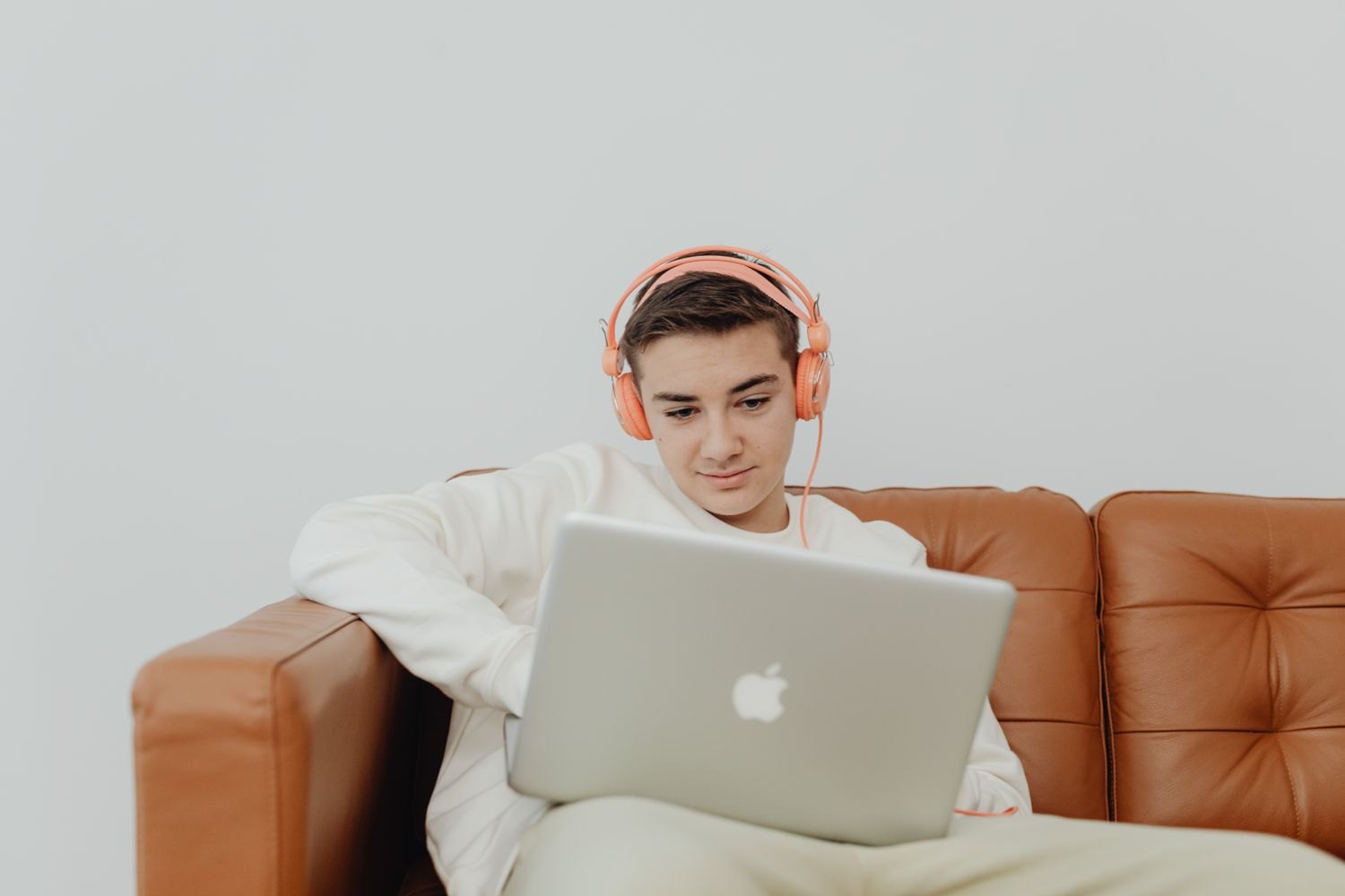 Laptop and headphones as devices for organising and listening to digital music.