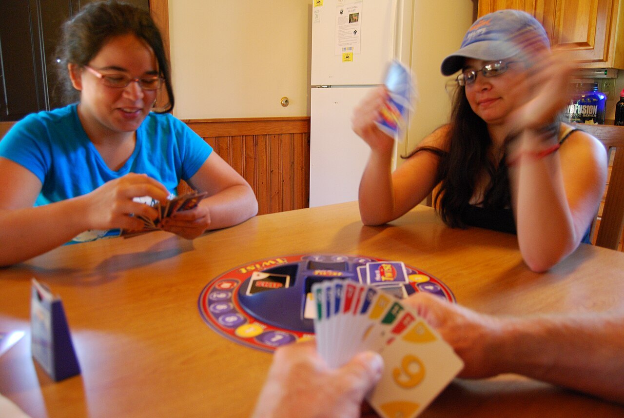 People sharing a tabletop game.