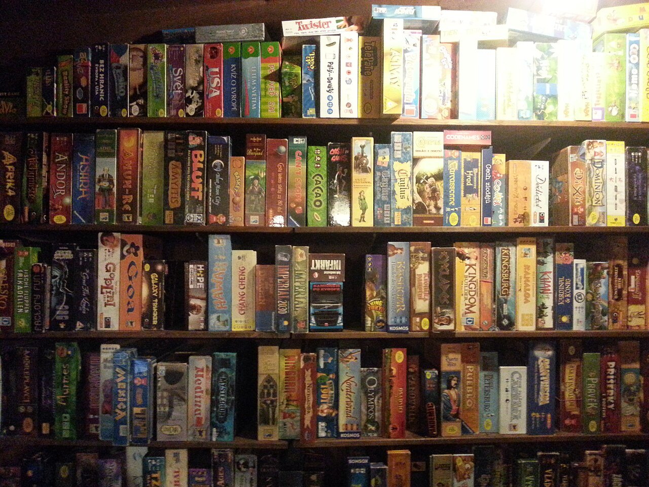Board game boxes on shelves.