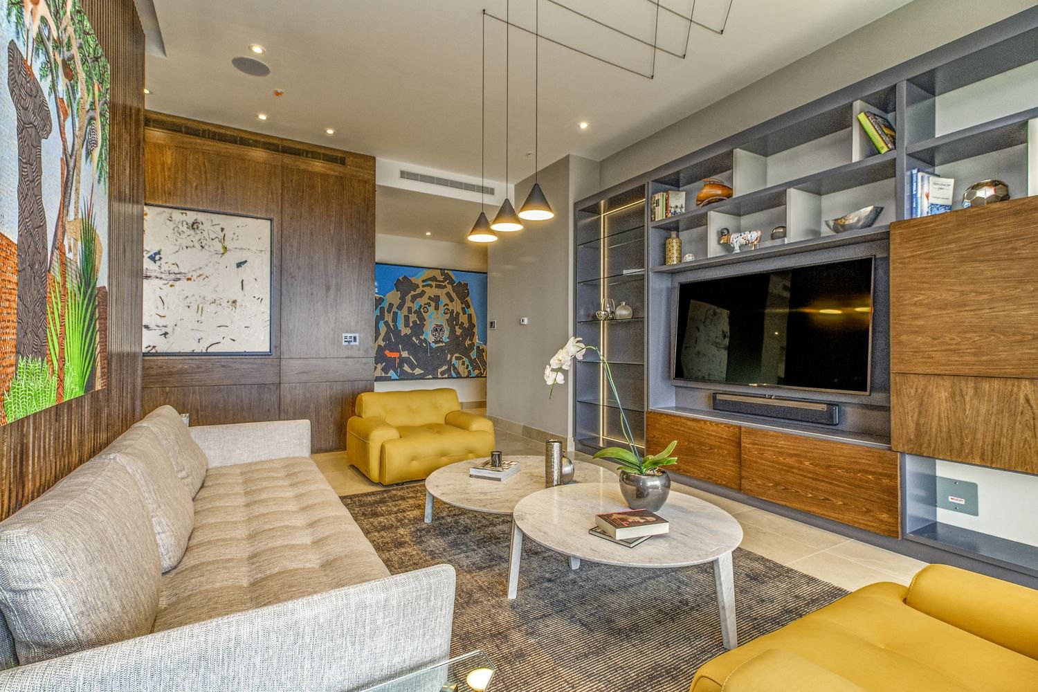 Television and seating arranged in a living room.