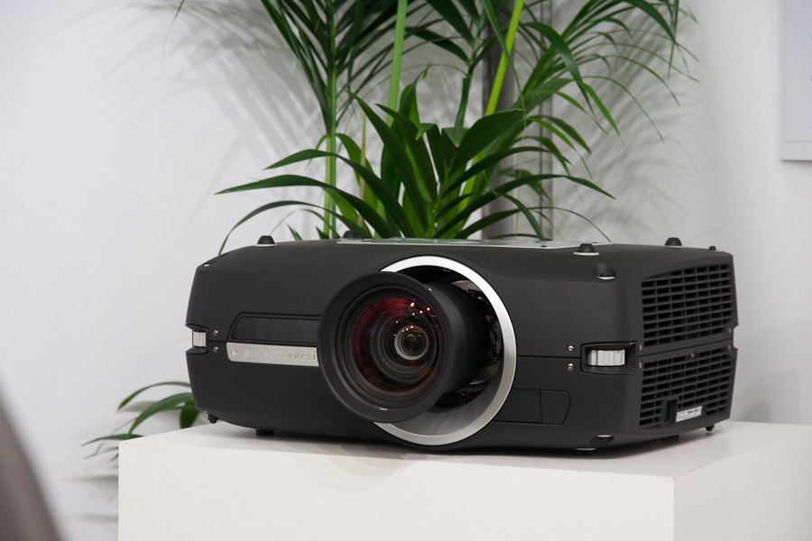 Projector with a ventilation grille visible on its side.