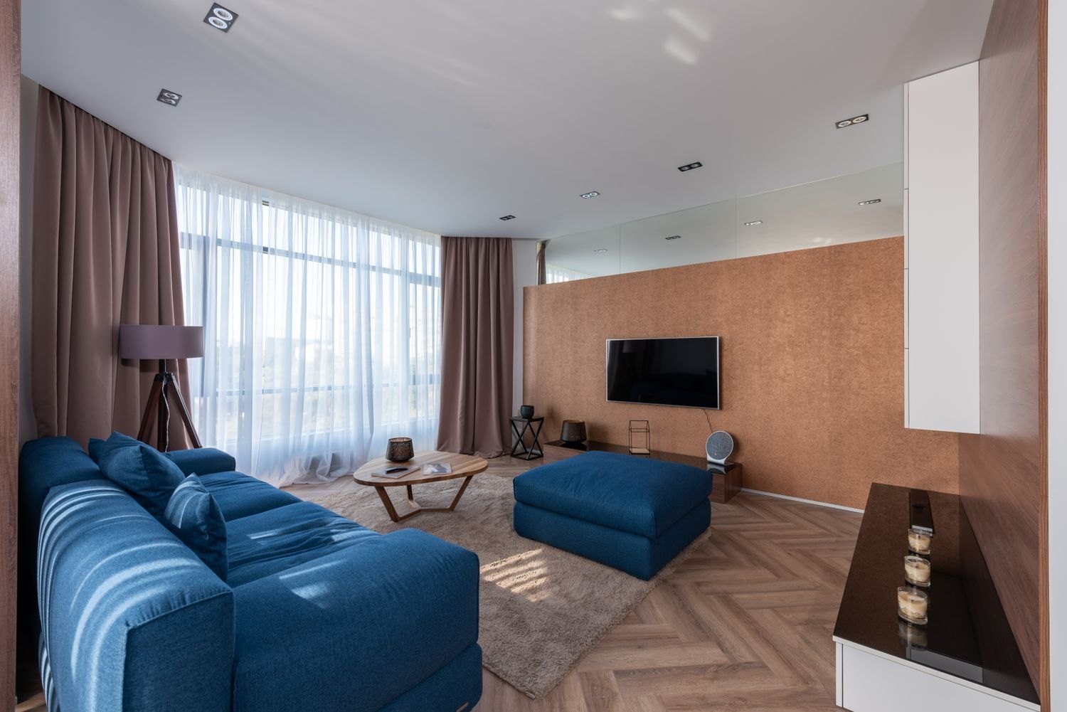 Curtains, a rug and upholstered furniture change the surfaces of a listening room.