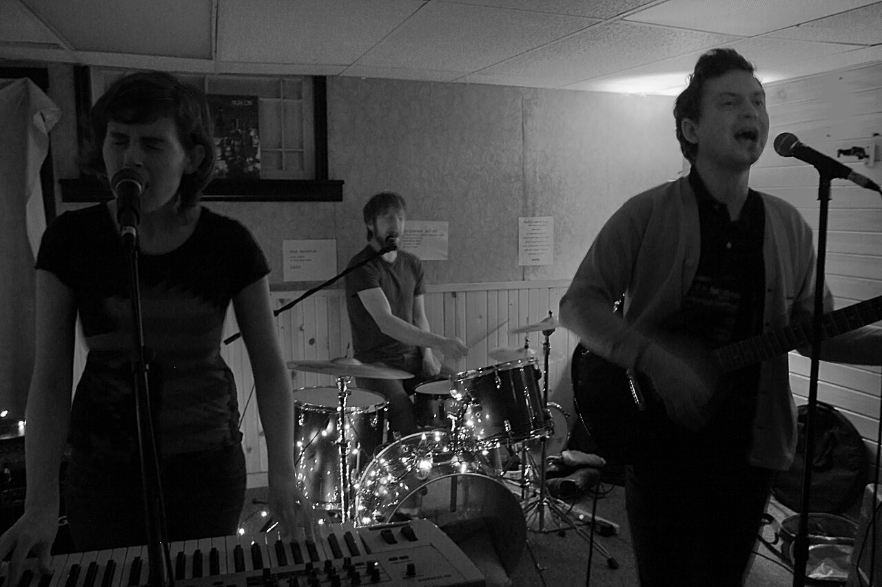 Band performing in a small indoor venue.