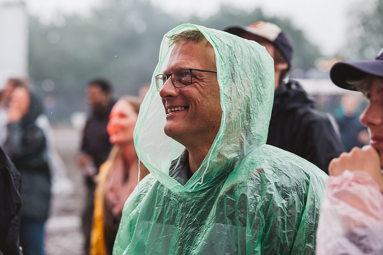 Festival attendee wearing a rain poncho.