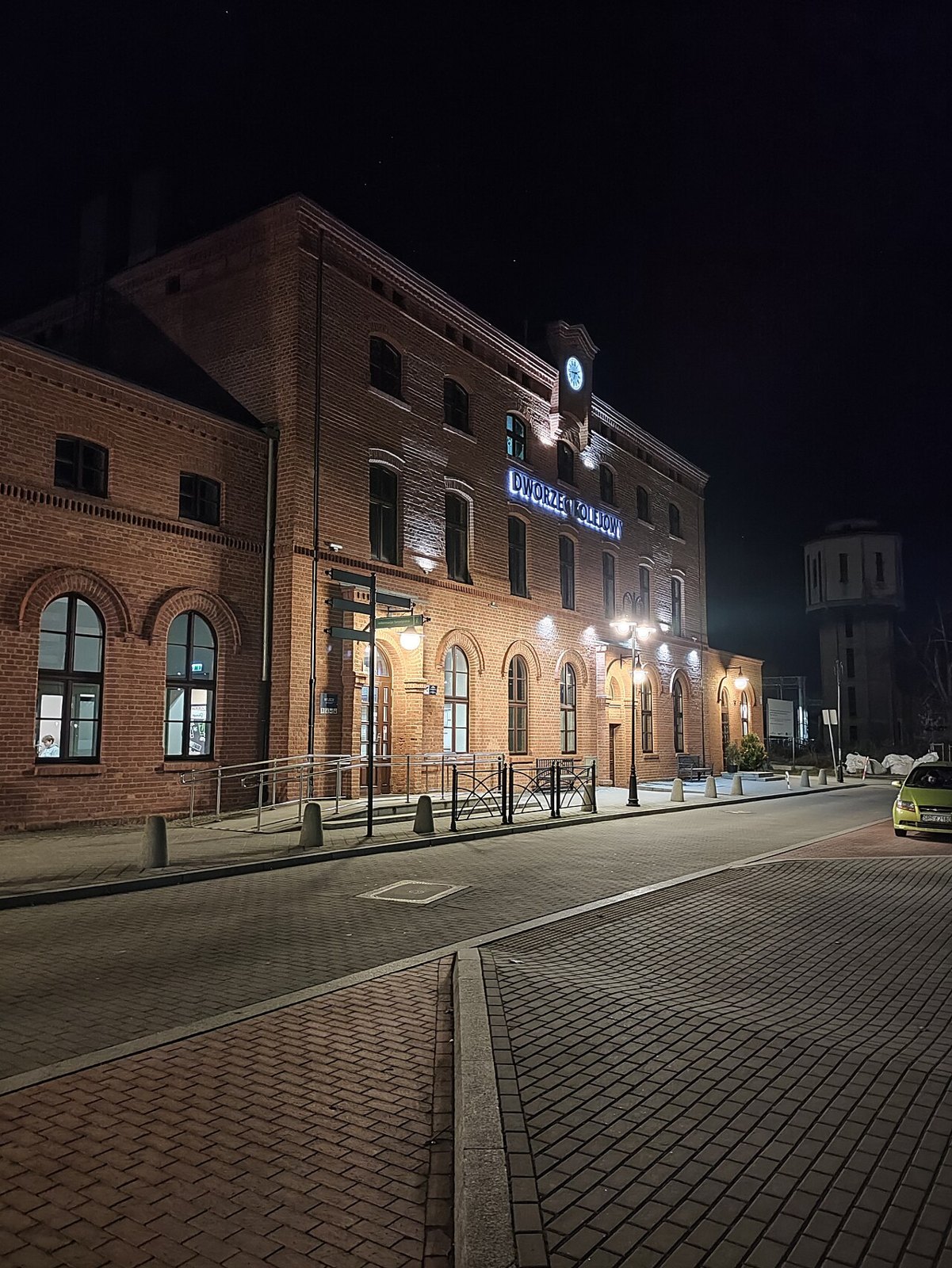 Railway station building at night.